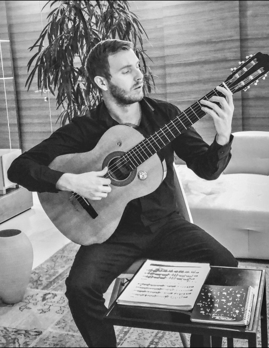 Vladimir Nanaktaev playing guitar